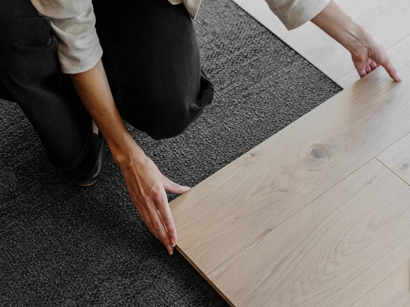 Client reviewing large flooring panel at the Havwoods Newcastle showroom.